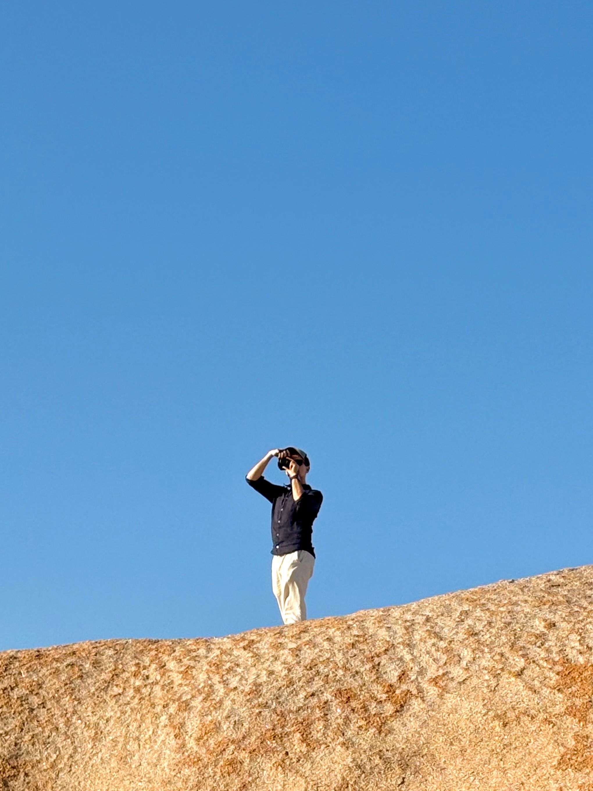 Peter Barrett, photographed from below on a granite dome